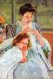 Young mother sewing